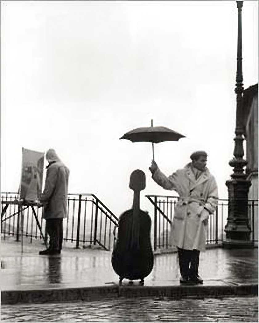 Reproduction Un musicien sous la pluie ROBERT DOISNEAU